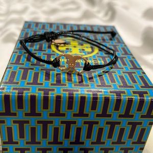 Beautiful brand new black Tory Burch bracelet with gold hardware.